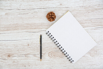 White note book and accessories and office stuff On Wooden Desk With Stationary Objects , Top View,Travel concept.copy space for text or design