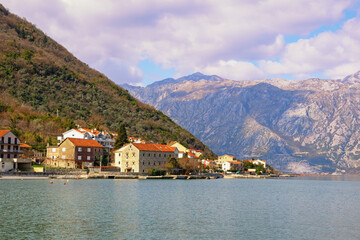 Fototapeta na wymiar Beautiful winter Mediterranean landscape. Montenegro, view of Bay of Kotor ( Adriatic Sea ) and seaside village of Stoliv