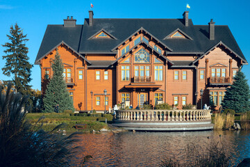 Kiev, Ukraine. November 2020. Residence of the ex-president of Mezhyhirya. Wooden house and museum in a beautiful park by the river. The log house is called Honka