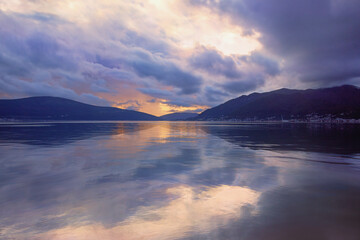 Fototapeta premium Evening Mediterranean landscape. Autumn sunset. Montenegro, Adriatic Sea, view of Kotor Bay near Tivat city