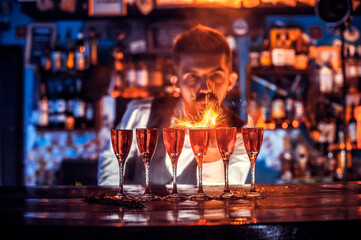 Barman creates a cocktail on the alehouse