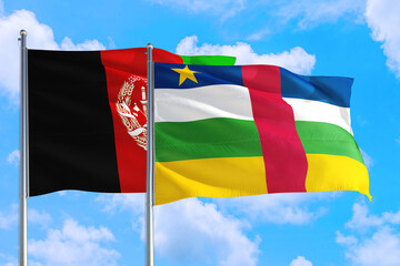 Central African Republic and Afghanistan national flag waving in the wind on a deep blue sky together. High quality fabric. International relations concept.