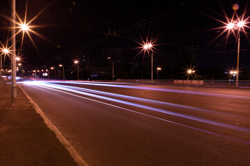 Fototapeta na wymiar Night traffic on the highway with lights 