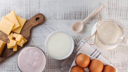 Banner flatlay a variety of dairy products, cheese, farm eggs. The concept of the farmer's market. Copy space.