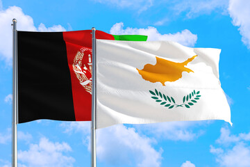 Cyprus and Afghanistan national flag waving in the wind on a deep blue sky together. High quality fabric. International relations concept.