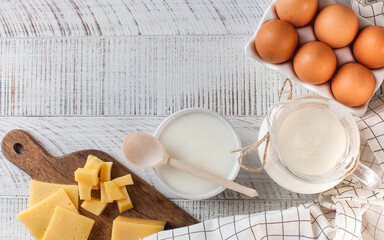 Banner flatlay a variety of dairy products, cheese, farm eggs. The concept of the farmer's market. Copy space.