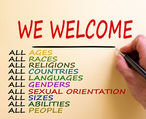 Hand writing 'we welcome', isolated on white background. Business concept.  Diversity ethnicity...