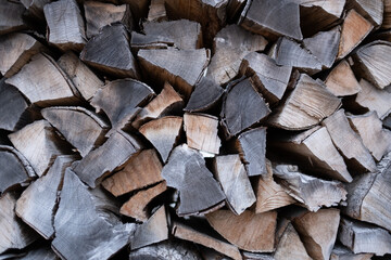 wallpaper of a weathered, dark, dramatic, beautiful old pile of wood before being used to burn in a fireplace