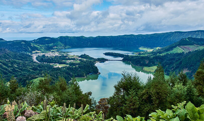 Fototapeta na wymiar Sete Cidades on Sao Miguel is a small town in a volcanic crater with a big crater lake