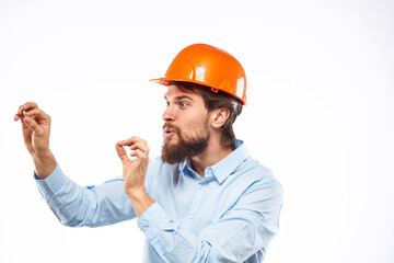 Emotional man gesturing with his hands construction industry orange hard hat work