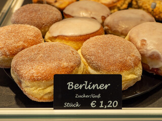 in the display of a bakery there is a wide variety of baked goods