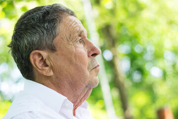 Portrait of a Pensive senior man Outdoors