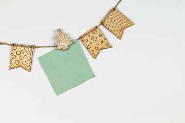 Winter background, with wooden flags and a note in a clothespin. Christmas.	