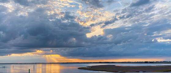 sunset over the river in Great Yarmouth, scenic landcape, background, cloudy