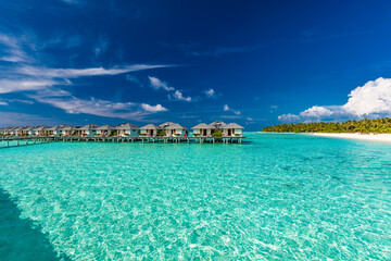 Beautiful summer beach paradise with sandy beach and villas