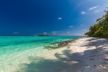White sandy beach in Maldives with amazing blue lagoon