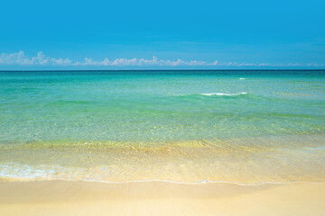 Soft blue ocean wave on sandy beach. Ocean blue Background.
