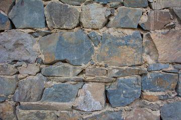Castle wall made of old stones textures for design and photo background.