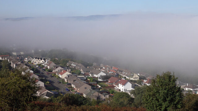 Panoramic view over Gourock from Lyle Hill. Low lying mist over houses. 