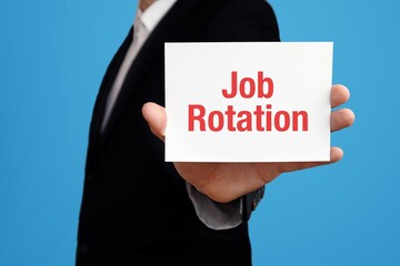 Job Rotation. Businessman in suit showing business card with text. Man isolated on blue background