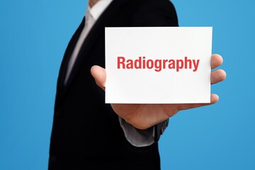 Radiography. Businessman in suit showing business card with text. Man isolated on blue background