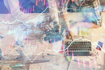 Double exposure of man and woman working together and financial graph hologram drawing. market analysis concept. Computer background. Top View.