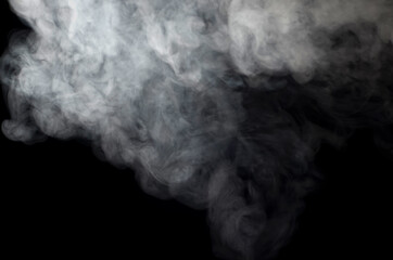 puffs of smoke thick on a black background close-up