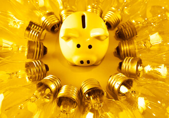 golden piggy bank and many Traditional  lightbulb around, creative business symbols