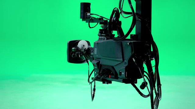 The camera jib is moving in a professional green screen studio. Film and Television Industry