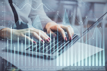 Multi exposure of woman hands typing on computer and financial graph hologram drawing. Stock market analysis concept.