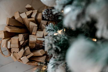 Wicker basket with wood and Christmas tree  with white and silver balls
