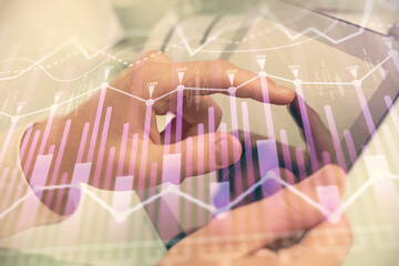 Multi exposure of man's hands holding and using a phone and financial chart drawing. Market analysis concept.