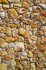 Wall made of rocks, stone wall.