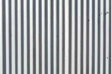 Corrugated metal exterior beaten by the weather.  Abstract background.