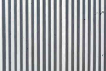 Corrugated metal exterior beaten by the weather.  Abstract background.