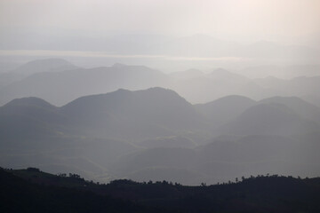 layers of mountains with fog