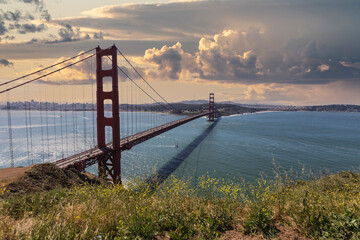 Golden Gate National Recreation Area hilltop sunset view towards the Golden Gate Bridge and San Francisco.