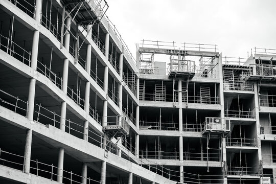 Black and white image of modern construction site with multiple steel protection supports