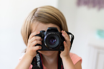 Child taking photos with camera