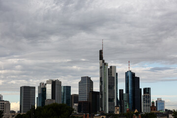 Obraz premium Cityscape with skyscrapers and cloudy sky