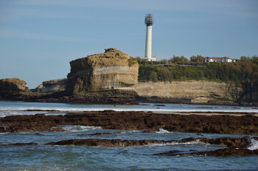 Low tide at the coast of Biarritz in the Bay of Biscay, the lighthouse in the background