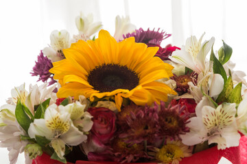 beautiful bouquet of flowers with a sunflower, detail of the petals and leaf, nature with sun