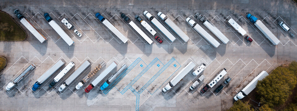 Truck stop on Rest area On the highway. Top view car parking lot. Truck Driver company. View from the bird's flight. Aerial photography. Copy space.