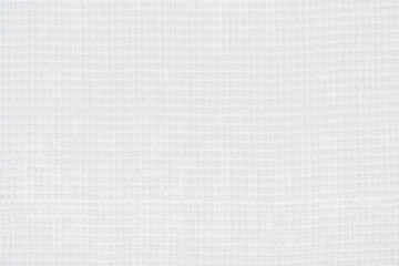Fototapeta na wymiar Background from white texture of canvas cotton fabric material. Close-up surface of blank abstract textile pattern backdrop, ready for text and copy space.