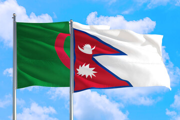 Nepal and Algeria national flag waving in the windy deep blue sky. Diplomacy and international relations concept.