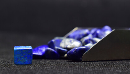 Lapis Is a beautiful natural gemstone on a wooden floor	