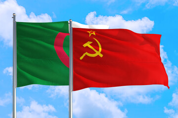 Soviet Union and Algeria national flag waving in the windy deep blue sky. Diplomacy and international relations concept.