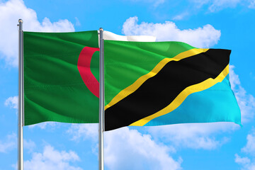 Tanzania and Algeria national flag waving in the windy deep blue sky. Diplomacy and international relations concept.