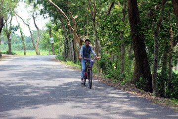 Young man with the bicycle