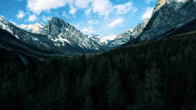 Aerial 4K Drone View of Fanes-Sennes-Prags Nature Park in the Dolomites, including Croda del Becco and Three Peaks Nature Park (Parco naturale Tre Cime) on a bright sunny spring day